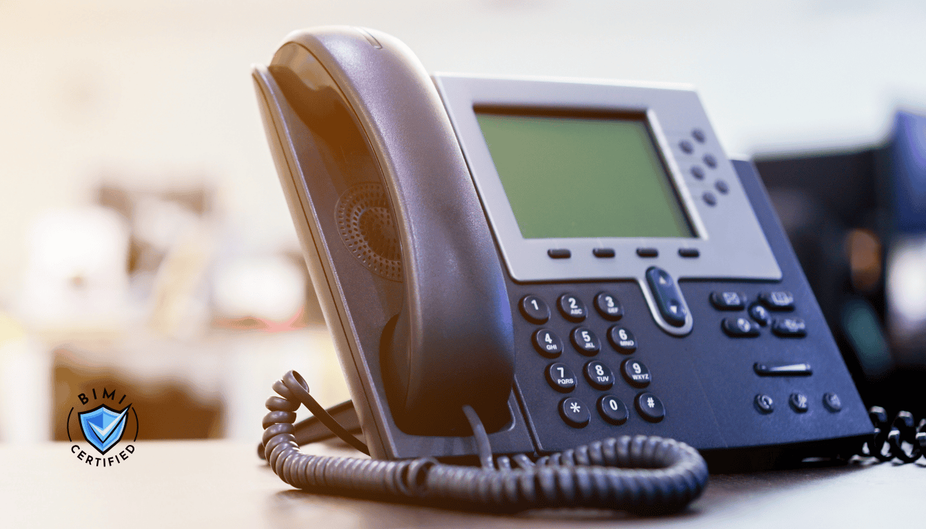 A modern telephone on the desk awaiting a BIMI Verification  call
